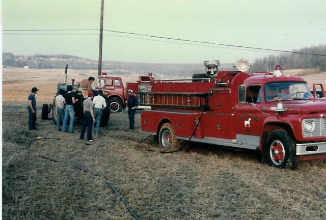 Whoops! A local farmer had to help us pull Engine 4-9-2 from this muddy field after a fire on Quarry Road... 3/10/86